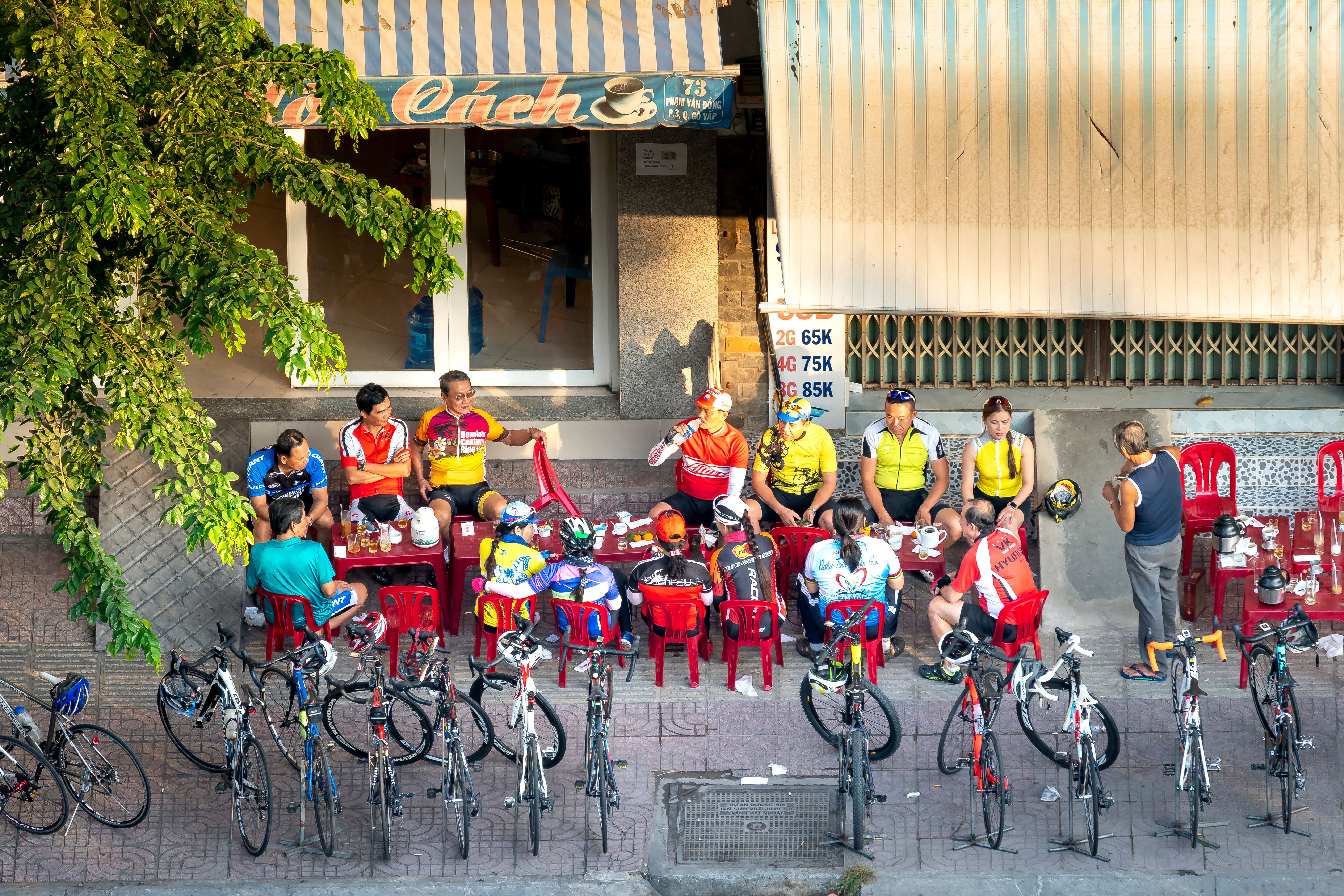 Cyclists gathering at a local café after a ride